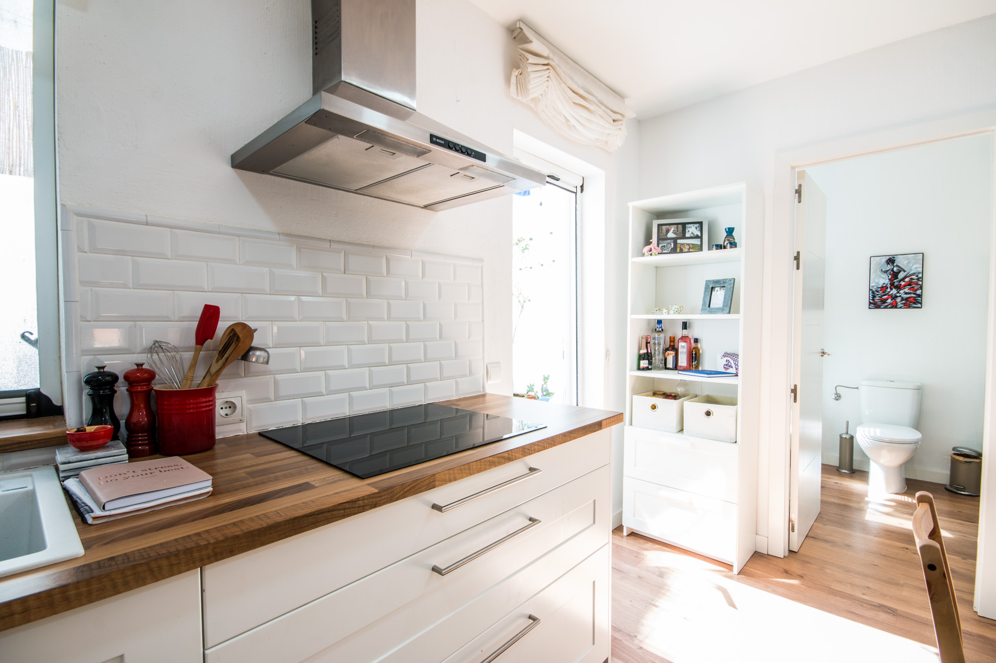 The kitchen and bathroom filled with light