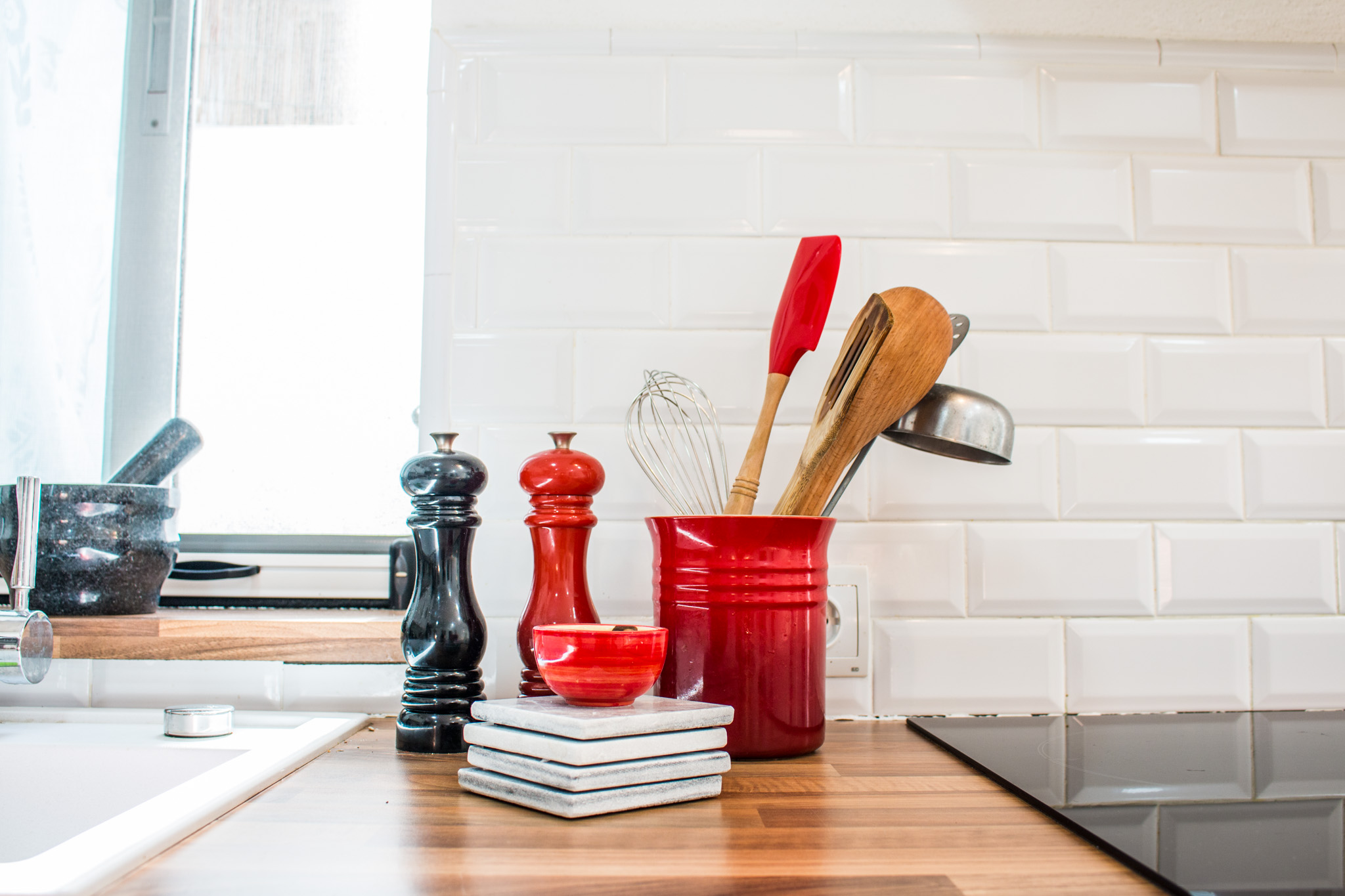 White tiles and wooden details in Ciaras kitchen