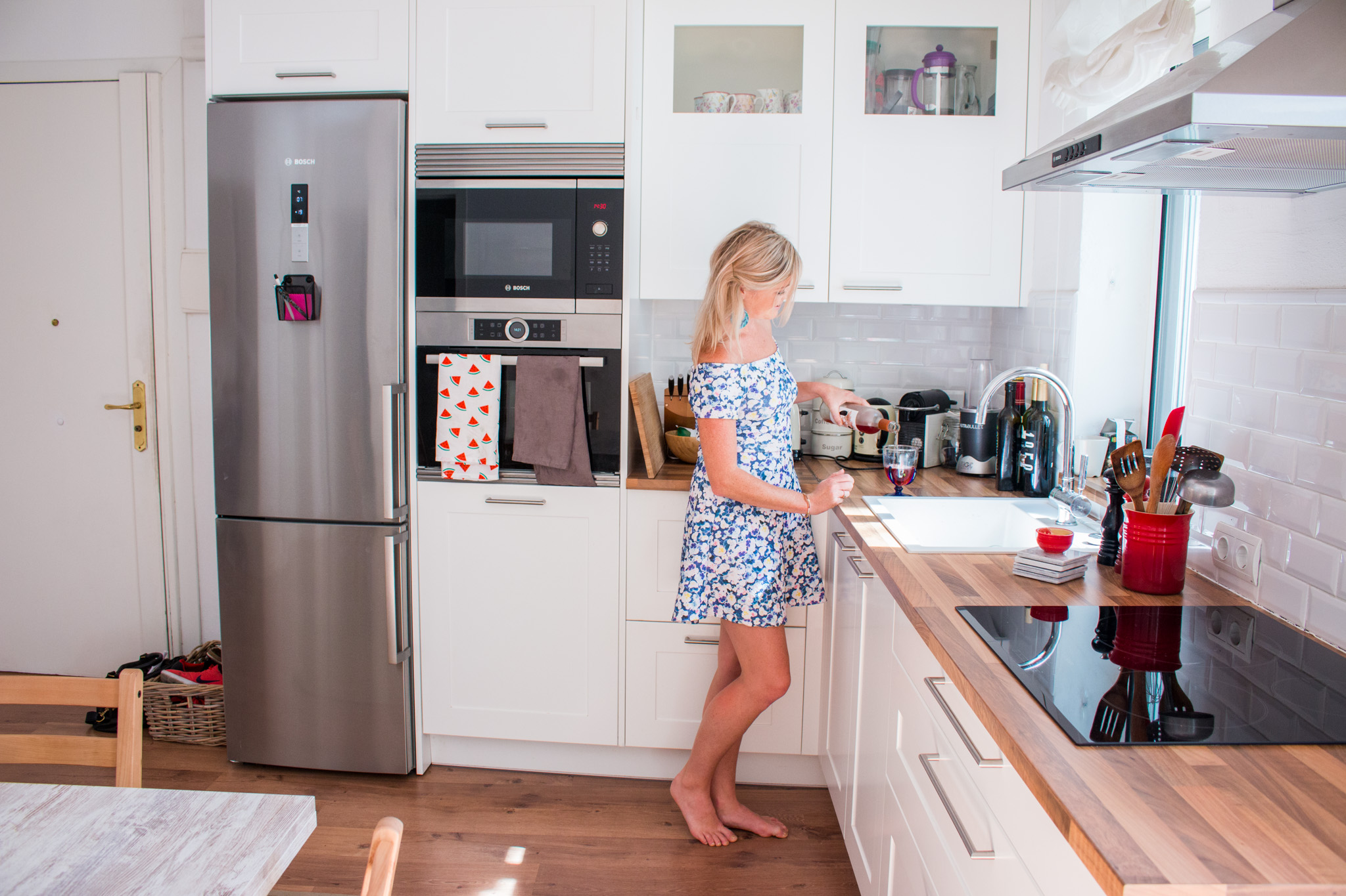 Ciara in her newly renovated kitchen with wooden floors